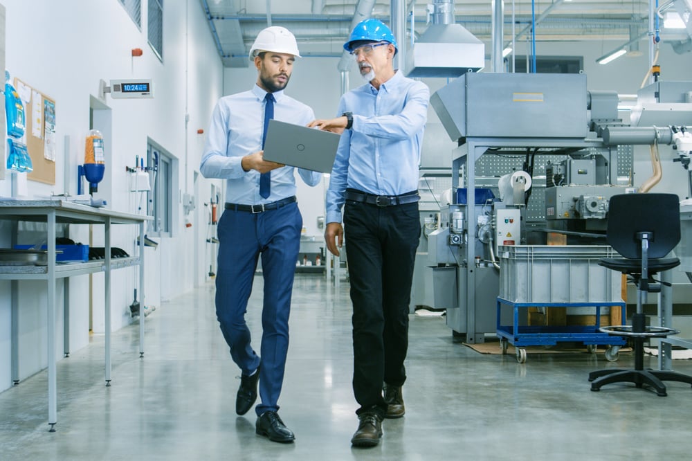 AtlasIED IP-DDS in Factory with two business men wearing hard hats