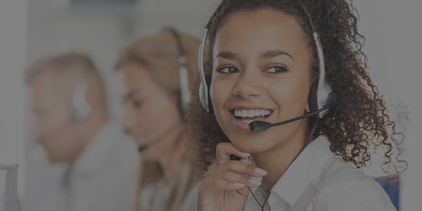AtlasIED Customer Service Specialist wearing headset